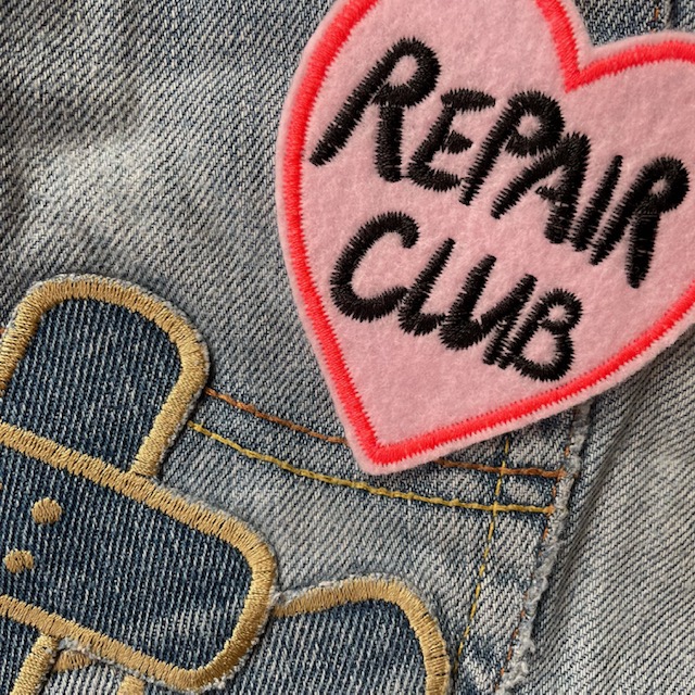 Iron-on image heart "Repair Club" patch in pink with black lettering iron-on patches for adults