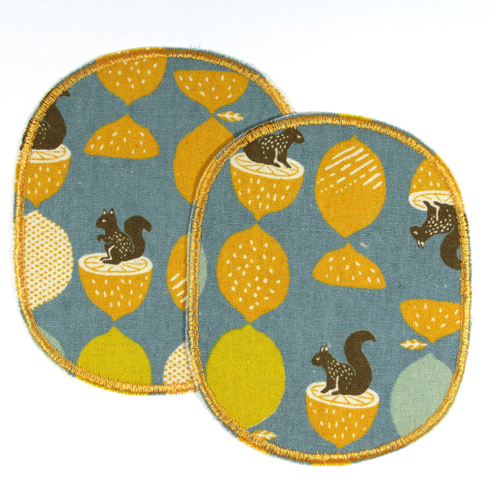 Squirrel and acorn motif on blue iron-on patches great for children's trousers